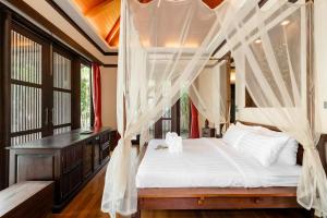 Voodi või voodid majutusasutuse The Retreat Koh Samui toas +11 fotot
