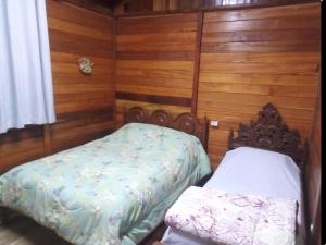 En eller flere senge i et værelse på Lugar de paz e sossego