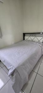 Ένα ή περισσότερα κρεβάτια σε δωμάτιο στο Suite in Arraial do Cabo