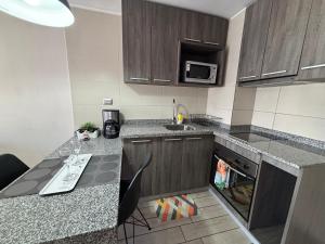 Køkken eller tekøkken på Hermoso Apartamento en la Capital de Chile + 5 billeder