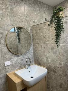 a bathroom with a sink and a mirror at Robe Holiday Park in Robe +36 photos