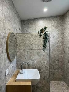 a bathroom with a sink and a mirror at Robe Holiday Park in Robe
