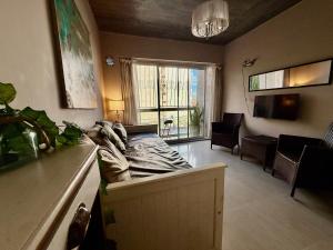 a living room with a couch and a table at Hermoso departamento barrio norte comodo amplio y luminoso in San Miguel de Tucumán +4 photos