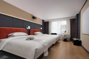 Voodi või voodid majutusasutuse Hotel Anaïs Divine Comedy toas