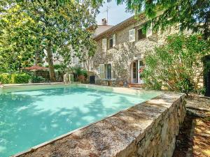 a swimming pool in front of a house at Charmante Villa à Montauroux, Piscine Privée, 8 Pers., Golf - FR-1-779-10 in Montauroux