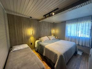 Ένα ή περισσότερα κρεβάτια σε δωμάτιο στο Cabana com Cachoeira