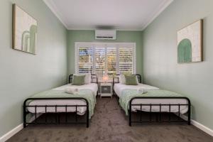 Ένα ή περισσότερα κρεβάτια σε δωμάτιο στο Kennington House 3BR Home in Bendigo City