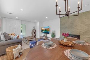 a living room with a table and a couch at Evergreen Garden Wi-Fi available close to Nike Intel Hospital Downtown in Portland