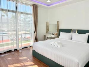 Katil atau katil-katil dalam bilik di Air diamond resort