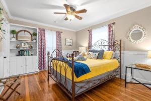 a bedroom with a bed and a ceiling fan at Whole Home 102 Madison Ter in Clarksville