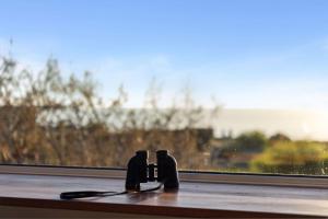 a pair of hair brushes sitting on a window sill at Large Renovated Home with Ocean Views for Family Fun in Peppermint Grove Beach in Capel