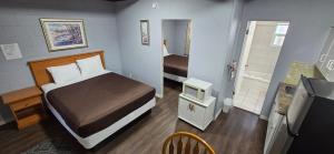 Postel nebo postele na pokoji v ubytování Flamingo Motel