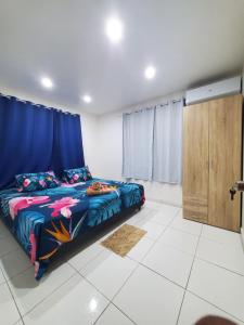 Postel nebo postele na pokoji v ubytování Vahinui lodge