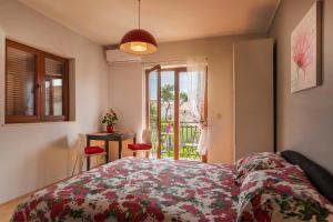 Postel nebo postele na pokoji v ubytování Ava apartmani