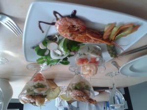 a plate of food with seafood on a table at Le Baudilois in Pont-de-Larn