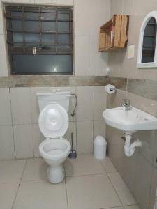 a bathroom with a toilet and a sink at Dreamland Self Catering and Backpackers CC in Keetmanshoop