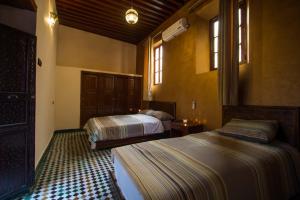 Letto o letti in una camera di Dar El Mathaf