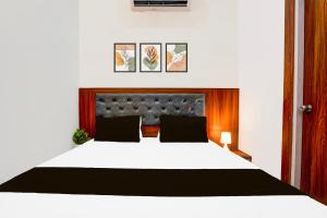Postel nebo postele na pokoji v ubytování Hotel O ADVENT HOTEL