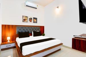 Postel nebo postele na pokoji v ubytování Hotel O ADVENT HOTEL