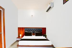 Postel nebo postele na pokoji v ubytování Hotel O ADVENT HOTEL