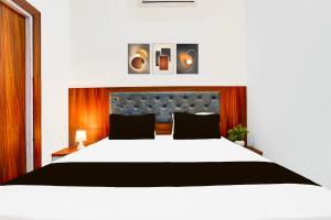 Postel nebo postele na pokoji v ubytování Hotel O ADVENT HOTEL