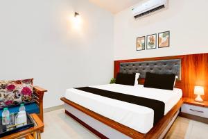 Postel nebo postele na pokoji v ubytování Hotel O ADVENT HOTEL