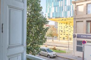 a car parked on a street next to a building at Harry Potter - Séjour magique à Poudlard in Saint-Étienne
