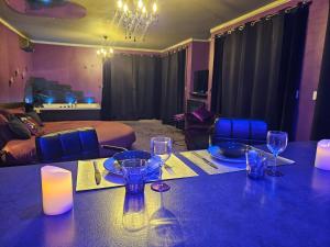 a dining room with a table with wine glasses on it at Purple Lovt in Perpignan