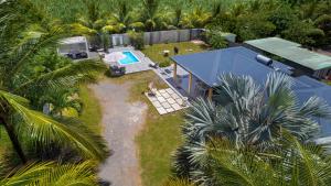 an aerial view of a house with a swimming pool at Villa Jardin secret de la boucan - OFFRE SAISONNIERE ! in Sainte-Rose