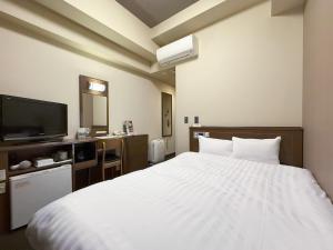 Katil atau katil-katil dalam bilik di Hotel Route-Inn Hakata Ekimae -Hakataguchi- +56 gambar