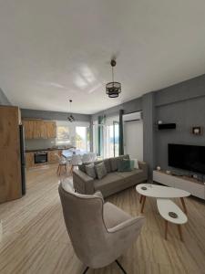 a living room with a couch and a table at SWEET HOME 1 in Himare