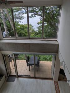 a view from the top of a house with a table at Villa 波音テラス vacation club in Ito +46 photos