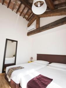 Katil atau katil-katil dalam bilik di Italianflat - Palazzo Rizzardi
