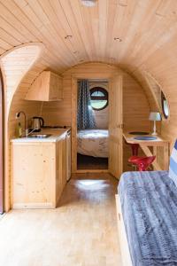 a small kitchen and a bedroom in a tiny house at Domaine De Marguerite in Janvry