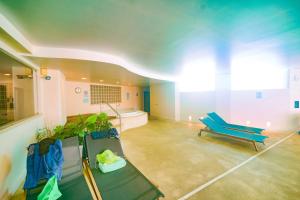 a large room with a couch and a tub in it at Estrela Apartment by Moje Holiday in Luz