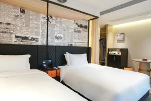 Arthur Hotel Baiyun Guangzhou客房内的一张或多张床位