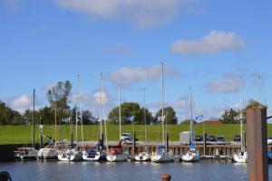 a group of boats docked at a marina at Ferienhaus Hanni in Schillig