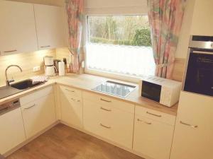 Kuchyň nebo kuchyňský kout v ubytování Ferienhaus Reckers
