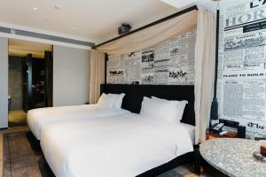 Arthur Hotel Baiyun Guangzhou客房内的一张或多张床位