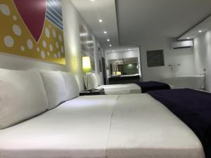 Postel nebo postele na pokoji v ubytování Mayafair All Inclusive