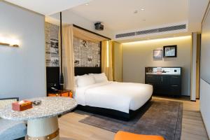 Arthur Hotel Baiyun Guangzhou客房内的一张或多张床位