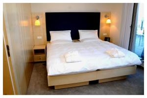Posteľ alebo postele v izbe v ubytovaní Hotel Erwin Junker