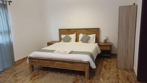 Postel nebo postele na pokoji v ubytování Hotel Hojari - Jabal Samhan, Salalah