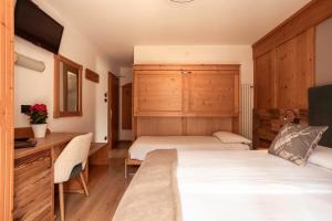Voodi või voodid majutusasutuse Hotel Aurora toas