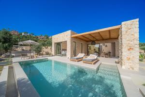 a villa with a swimming pool and a house at Lithos Art Villas - Armonia in Lakíthra