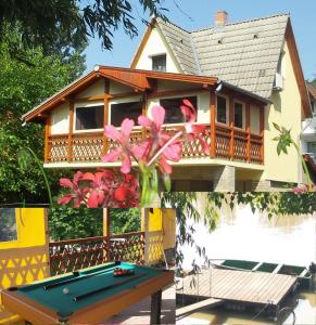 a house with a pool table in front of it at Tiszavirág Vendégház in Szeged