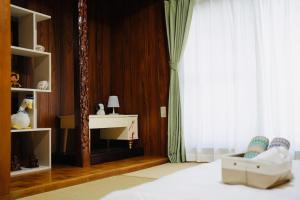 Krevet ili kreveti u jedinici u okviru objekta 雅舍 独栋两层 步行5分钟到天下茶屋站 关西机场35分钟直达天下茶屋站