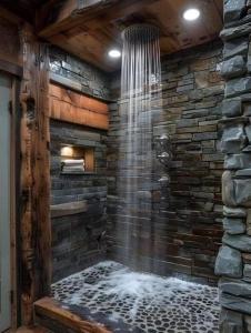 a shower in a room with a stone wall at Sky resort ajk patikka in Muzaffarabad