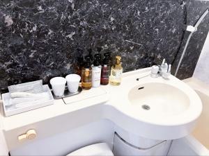 Koupelna v ubytování HOTEL LiVEMAX BUDGET Sagamihara + 13 fotografií