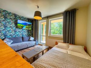 Posteľ alebo postele v izbe v ubytovaní Apartamenty Szóstka Wisła Kamienna